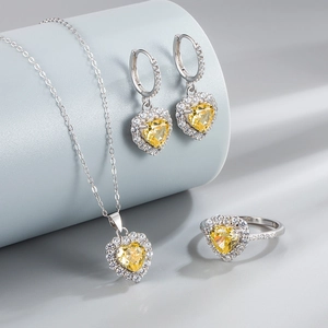 925 Sterling Silver jewelry set featuring heart-shaped yellow stones and sparkling halos