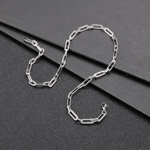 Macro shot of silver stainless steel thick link chain with rectangular square buckles