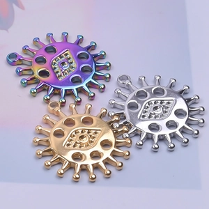 Macro shot of sun eye pendants in rainbow, gold and silver 18k plated stainless steel
