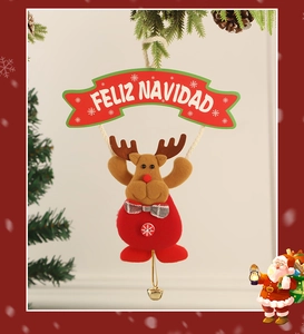 Detail of plush reindeer Christmas ornament with Feliz Navidad banner and gold bell