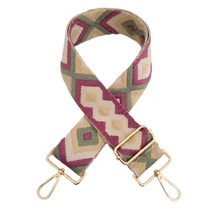 Detail of bohemian geometric rhombus woven strap with gold metal buckles in khaki green purple
