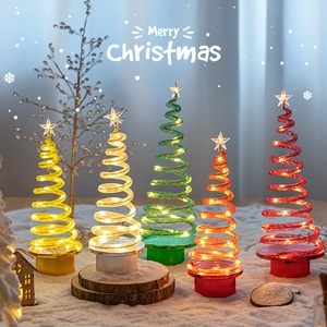 Five spiral LED mini Christmas trees with star toppers in diverse colors for desk decor
