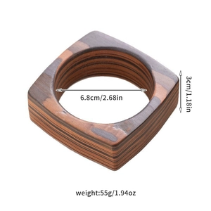 Detail view of square wooden bangle with size dimensions and natural grain texture