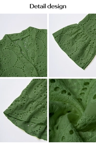 Détail de broderie ajourée verte sur chemisier à col en V et manches bouffantes