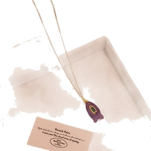 Cute gold chain necklace with purple fish pendant and green gemstone for women
