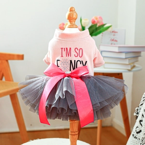 Detail of pink pet formal dress featuring a luxury satin bow with rhinestone embellishment