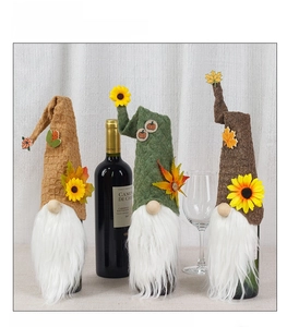 Three-piece gnome wine bottle covers with sunflower and maple leaf details for Thanksgiving