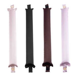 Set of four satin heatless hair curlers in pink, black, brown, and purple with snap buttons