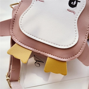 Close-up of pink penguin crossbody bag with lychee grain texture and neat stitching