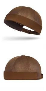 Close-up of brown mesh miki hat featuring breathable fabric and adjustable metal buckle
