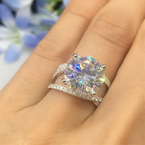 Close-up of silver zircon ring set with a large round-cut stone and a matching band