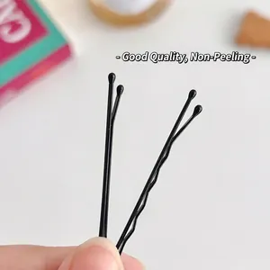 Set of 100 black metal bobby pins including straight and wavy styles for hair styling