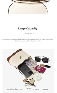 Detail view of large capacity crossbody bag interior with divided storage and metal lock