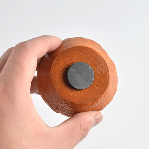 Realistic orange fridge magnet with textured skin and strong circular back magnet