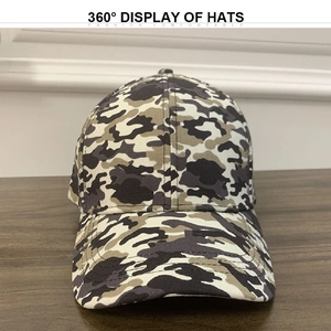 Front view of camouflage tactical baseball cap with six-panel design on wooden table