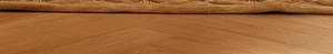 Dettaglio del tessuto marrone del letto per gatti con texture a rilievo su parquet
