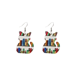 Detail of acrylic cat earrings featuring colorful book shelf patterns for teachers