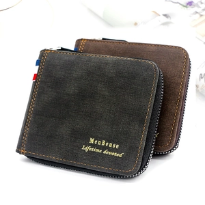 Close-up of frosted faux leather wallets with contrast stitching and tricolor ribbon