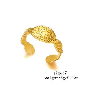 Detail view of gold geometric ring with sunburst pattern showing size 7 and 3g weight