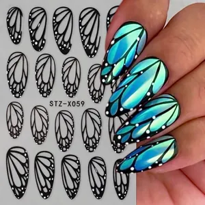Dark butterfly wing nail stickers with blue-green gradient finish and white dots