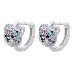 Detailed macro view of colorful rhinestone-encrusted teddy bear hoop earrings in silver finish
