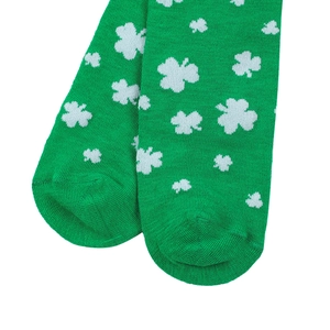 Close-up of green knitted sock toe featuring a white shamrock for St. Patrick’s Day