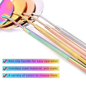 Detail of colorful stainless steel lash mirrors with non-slip handles for lash extensions