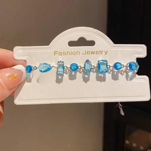 Detail showing various blue crystal cuts and silver metal setting on the bracelet