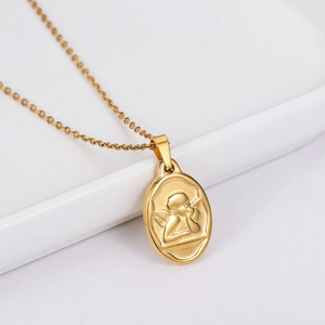 Golden oval Cupid pendant necklace with angel relief on a minimalist white background