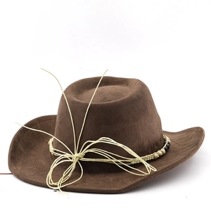 Dark brown suede cowboy hat with ethnic bead decorations and woven band on white background
