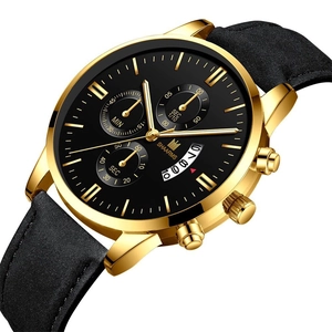 Close-up of stylish men's chronograph watch with gold case, black dial and date window