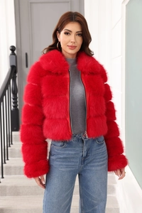 Detail of red faux fur coat showing plush texture, wide collar and metal zipper closure