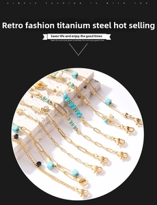 Detailed view of vintage titanium steel bracelets with turquoise and pearl accents