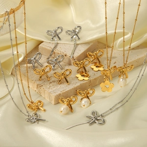 Bow knot 18K gold stainless steel jewelry set with pearls and clover charms