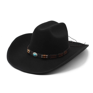 Classic black wool felt western cowboy hat with turquoise beaded band on white background