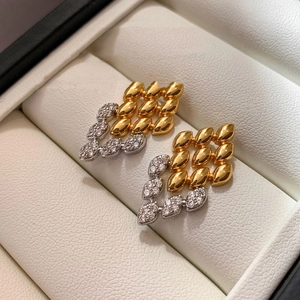 Boucles d'oreilles tissées géométriques or et argent avec cristaux de zircon brillants