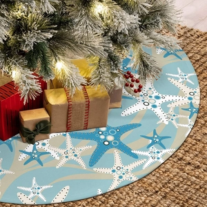 Starfish pattern Christmas tree skirt under a decorated tree on a rustic jute rug
