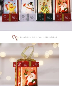 Detail of LED Christmas gift box lamps with Santa and Snowman holiday illustrations