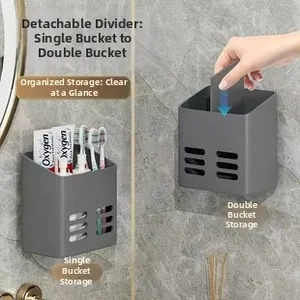 Detail view of matte grey wall-mounted storage box with removable divider and drainage holes