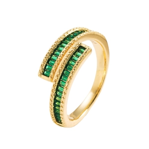 18K gold plated ring with emerald green zircon stones on a white background