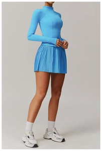 Sky blue athletic set with long-sleeve half-zip top and pleated tennis skirt details
