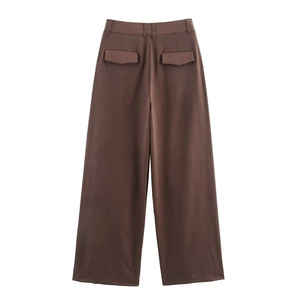 Detail view of brown high-waisted wide-leg trousers featuring rear pocket flap design
