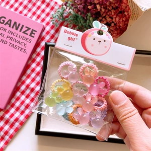 Close-up of colorful bunny hair ties with frosted finish for little girls in packaging
