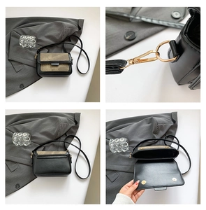 Detail of vintage color-block bag with gold hardware, magnetic buckle and adjustable strap