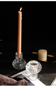 Macro shot of vintage ribbed glass candle holders with elegant textured stripe details