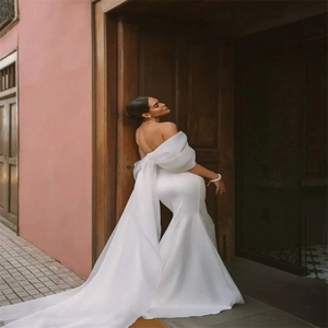 Elegant white satin off-shoulder mermaid wedding dress with large back bow and long train