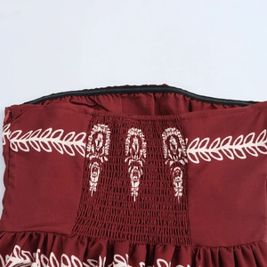 Ethnic print bandeau dress in burgundy featuring smocked elastic bodice for summer vacations