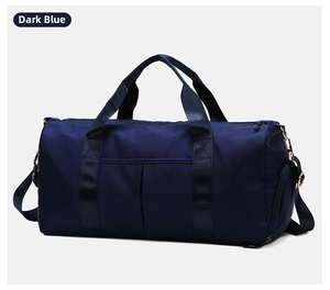 Detail of dark blue waterproof nylon travel bag with reinforced handles and side shoe compartment