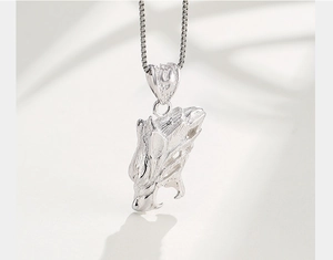 Macro shot of S925 sterling silver dragon head pendant with intricate engraved details
