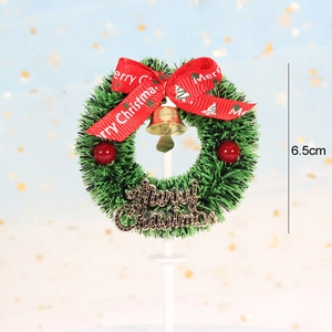 Close-up of a 6.5cm dollhouse Christmas wreath with red bow and Merry Christmas sign